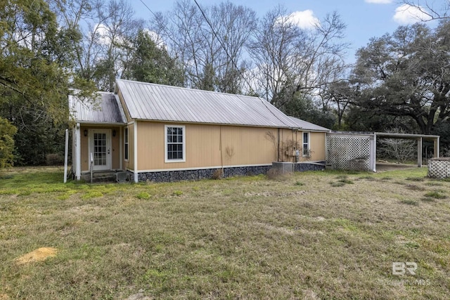 view of home's exterior featuring a yard