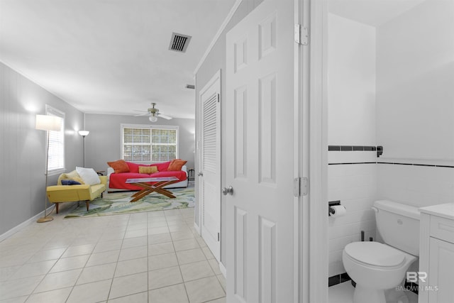 2774 N Grafhill Dr, Mobile, AL 36606 - bathroom featuring a ceiling fan, tile patterned flooring, and a closet