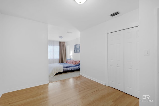 2774 N Grafhill Dr, Mobile, AL 36606 - bedroom featuring light wood-style flooring and a closet