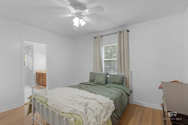 2774 N Grafhill Dr, Mobile, AL 36606 - bedroom with light wood finished floors, a ceiling fan, and connected bathroom