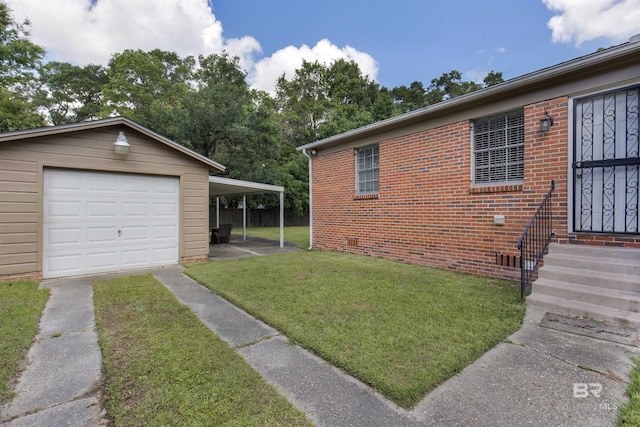 2774 N Grafhill Dr, Mobile, AL 36606 - view of side of home with a yard, driveway, crawl space, brick siding, and an outbuilding