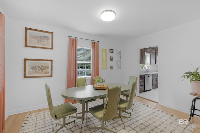 2774 N Grafhill Dr, Mobile, AL 36606 - dining space with light wood-type flooring and baseboards
