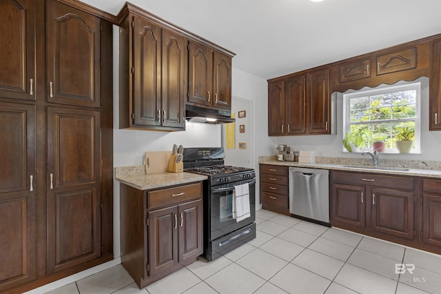 2774 N Grafhill Dr, Mobile, AL 36606 - kitchen with dishwasher, black gas stove, under cabinet range hood, and light stone counters