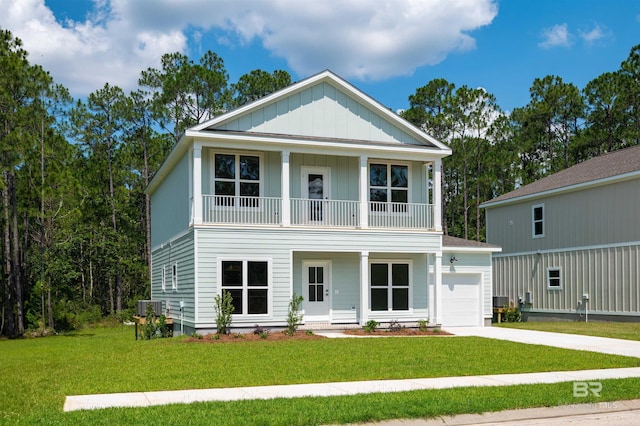 657 Island Way, Gulf Shores, AL 36542 - view of front of property with a balcony, a garage, board and batten siding, a porch, and a front lawn