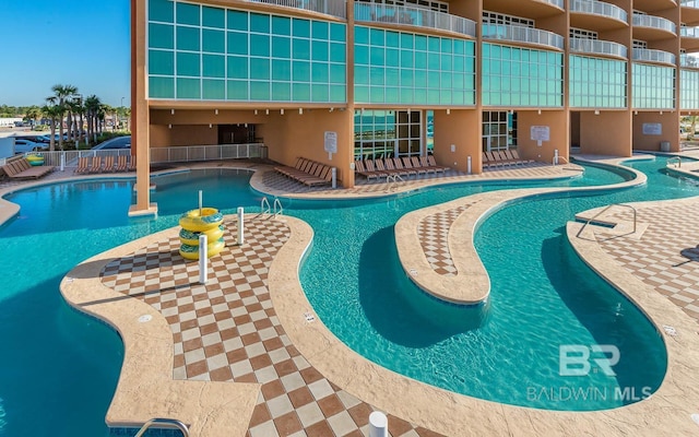 pool featuring a patio area