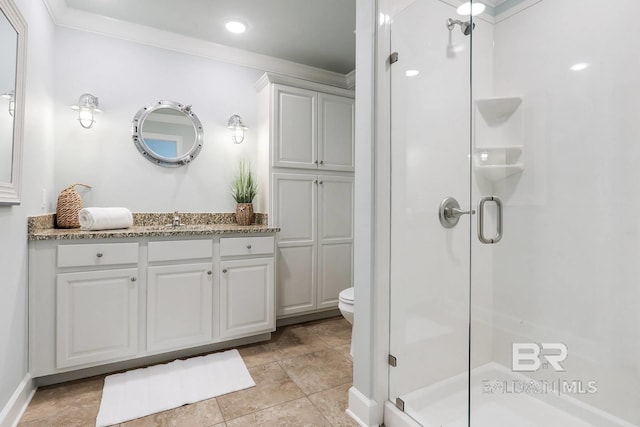 full bath with ornamental molding, a stall shower, vanity, and toilet