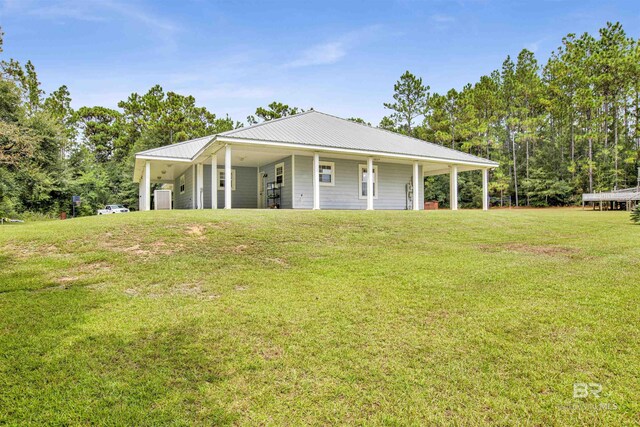 exterior space featuring a yard and a porch