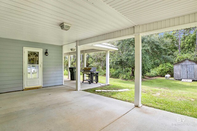 view of patio featuring grilling area and a shed