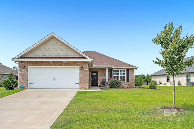 view of front of house with central AC, brick siding, a garage, a front yard, and driveway
