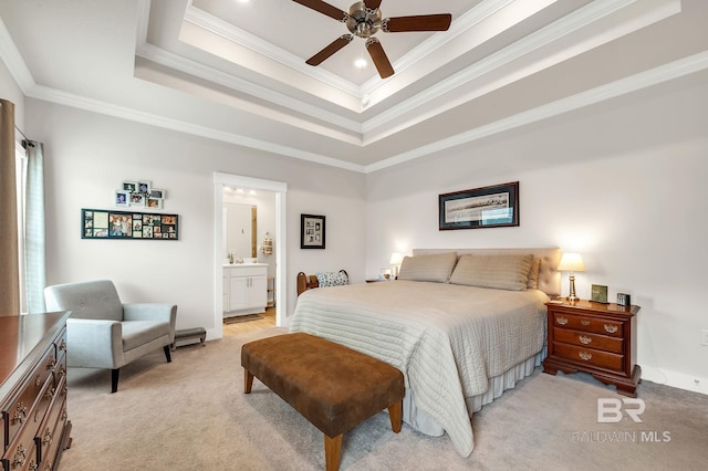 bedroom with baseboards, light colored carpet, ornamental molding, and a raised ceiling