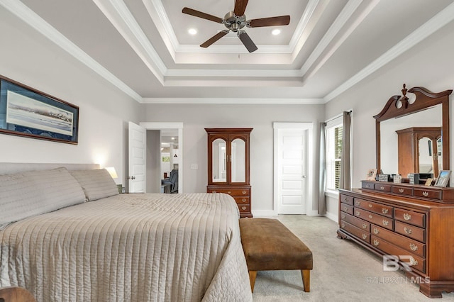 bedroom featuring crown molding, recessed lighting, a tray ceiling, and light colored carpet