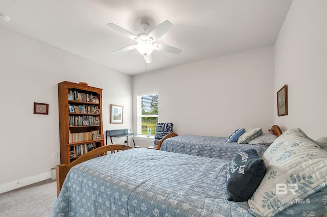 bedroom featuring carpet floors, ceiling fan, and baseboards
