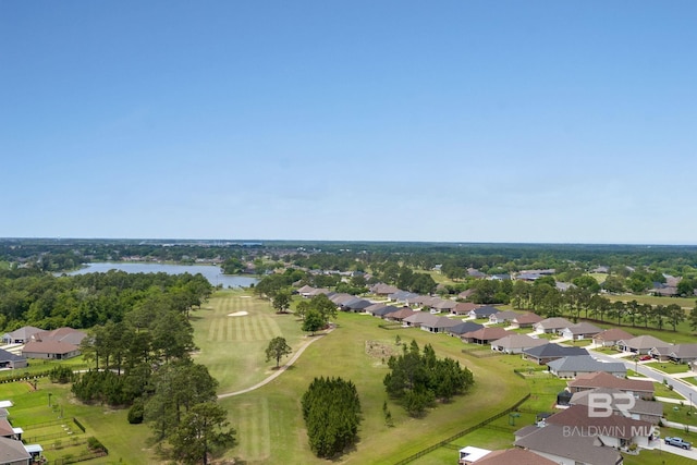 birds eye view of property with a water view and a residential view