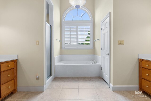 bathroom featuring vanity, separate shower and tub, and tile patterned floors