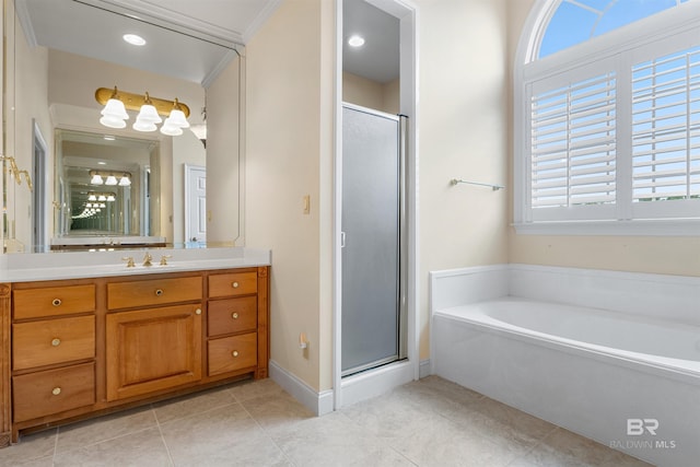 bathroom with a healthy amount of sunlight, vanity, separate shower and tub, and ornamental molding