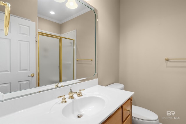 bathroom with ornamental molding, vanity, toilet, and an enclosed shower