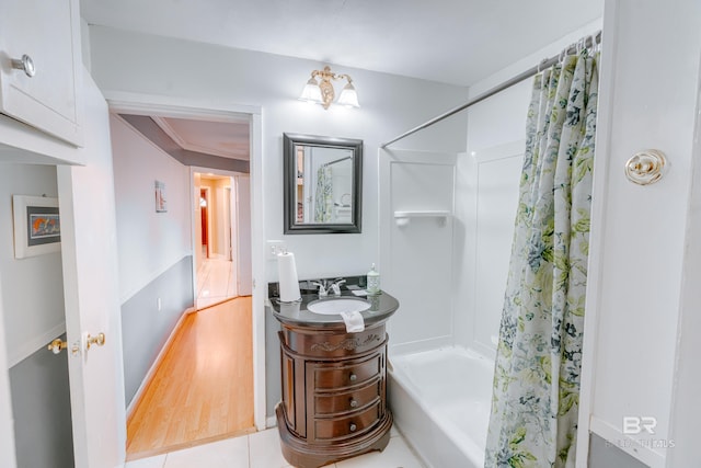 bathroom with shower / tub combo, tile patterned floors, vanity, crown molding, and a chandelier