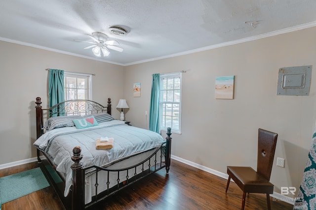 bedroom with multiple windows, ceiling fan, dark wood-type flooring, and ornamental molding