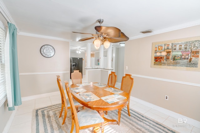 dining room featuring ceiling fan, ornamental molding, and light tile patterned flooring