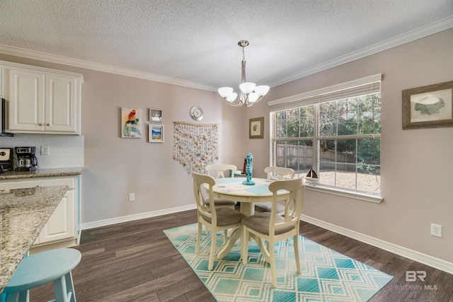 dining area featuring a notable chandelier, dark wood-type flooring, ornamental molding, and a textured ceiling