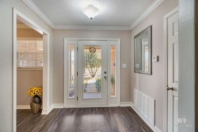 doorway featuring plenty of natural light, a textured ceiling, and dark hardwood / wood-style flooring