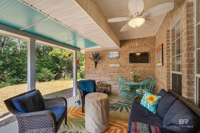 view of patio featuring ceiling fan