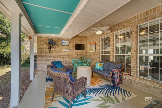 view of patio with an outdoor living space and ceiling fan