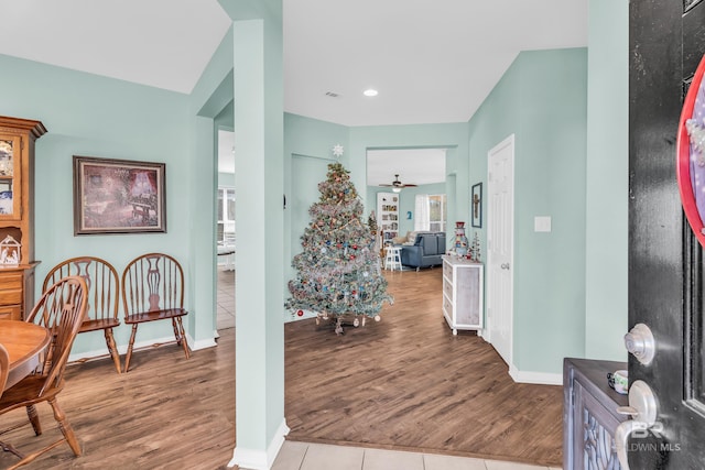 interior space featuring ceiling fan and light wood-type flooring