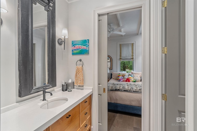 bathroom featuring vanity, hardwood / wood-style floors, and ceiling fan