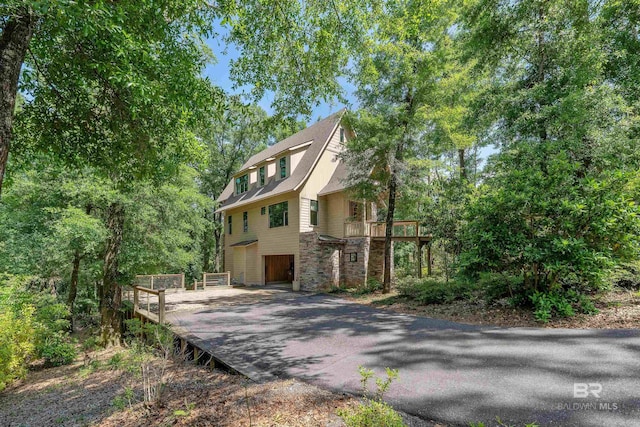 view of property exterior featuring a garage