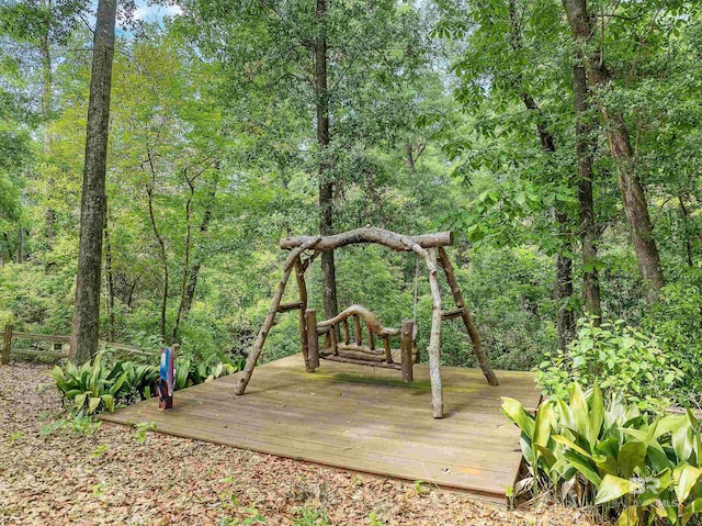 view of playground featuring a deck