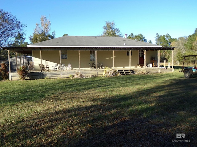 back of house with a yard