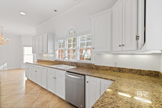 kitchen featuring sink, stone countertops, light tile patterned floors, stainless steel dishwasher, and white cabinets