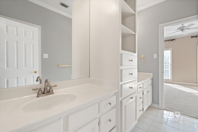 bathroom featuring vanity, tile patterned floors, ornamental molding, and ceiling fan