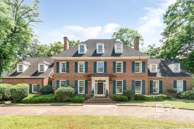 41 Yester Pl, Mobile, AL 36608 - colonial house with a chimney, a front yard, and brick siding