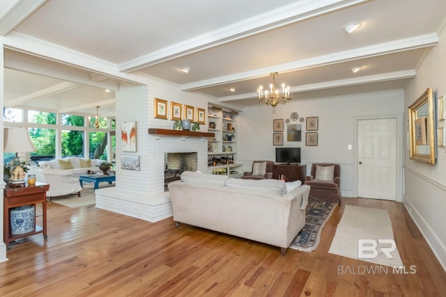 41 Yester Pl, Mobile, AL 36608 - living area with light wood finished floors, beam ceiling, and a chandelier