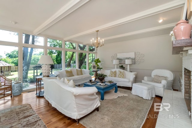 41 Yester Pl, Mobile, AL 36608 - living area with beamed ceiling, a fireplace, a chandelier, and plenty of natural light