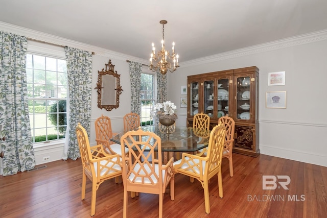 41 Yester Pl, Mobile, AL 36608 - dining room featuring ornamental molding, a notable chandelier, and wood finished floors