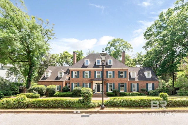 41 Yester Pl, Mobile, AL 36608 - colonial inspired home featuring a chimney and brick siding