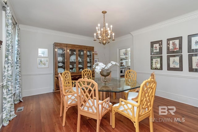 41 Yester Pl, Mobile, AL 36608 - dining space with crown molding, visible vents, baseboards, wood finished floors, and a notable chandelier