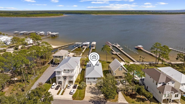 drone / aerial view featuring a residential view and a water view