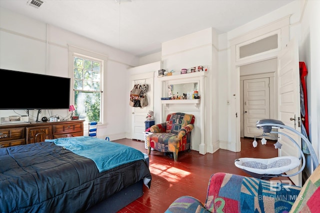 bedroom featuring dark hardwood / wood-style floors