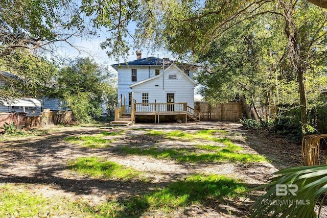 back of house with a wooden deck