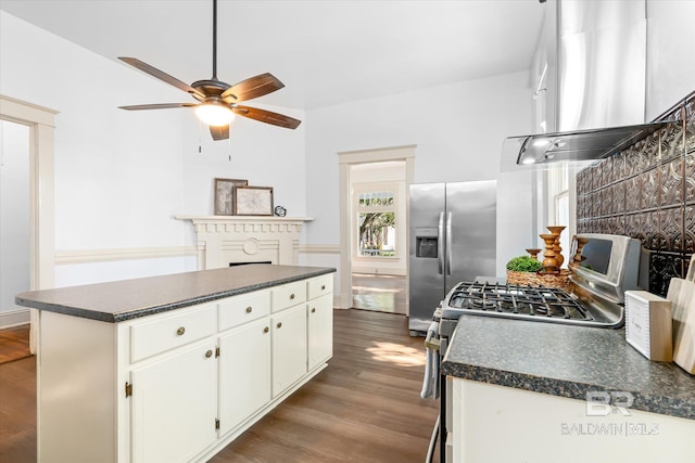 kitchen with white cabinetry, range hood, stainless steel appliances, wood-type flooring, and a kitchen island