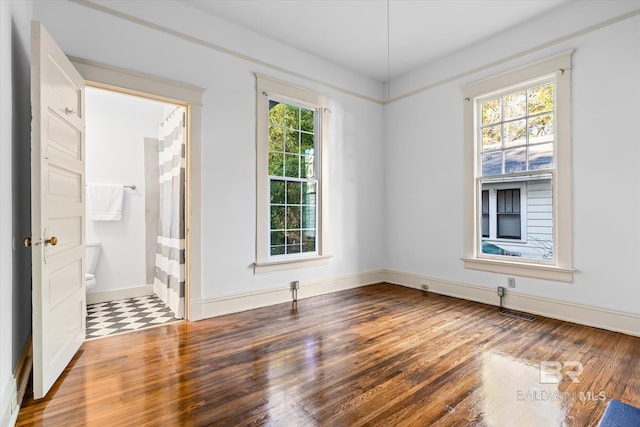 empty room with dark wood-type flooring