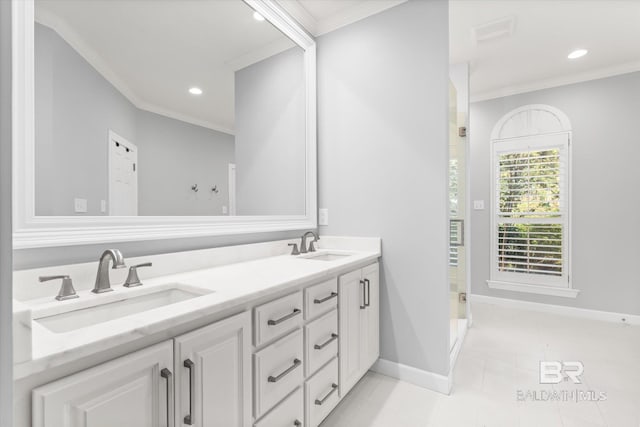 bathroom with tile patterned flooring, vanity, a shower with door, and ornamental molding