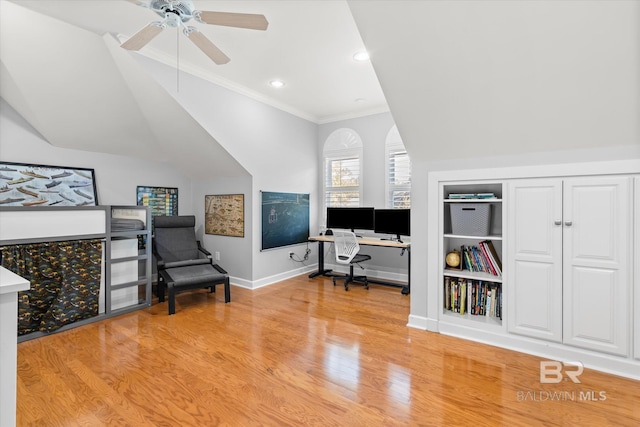 office space with crown molding, ceiling fan, and light wood-type flooring