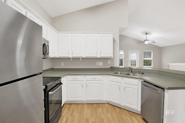 kitchen featuring appliances with stainless steel finishes and white cabinets