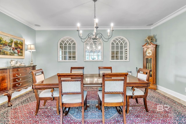 dining space with crown molding, baseboards, and an inviting chandelier