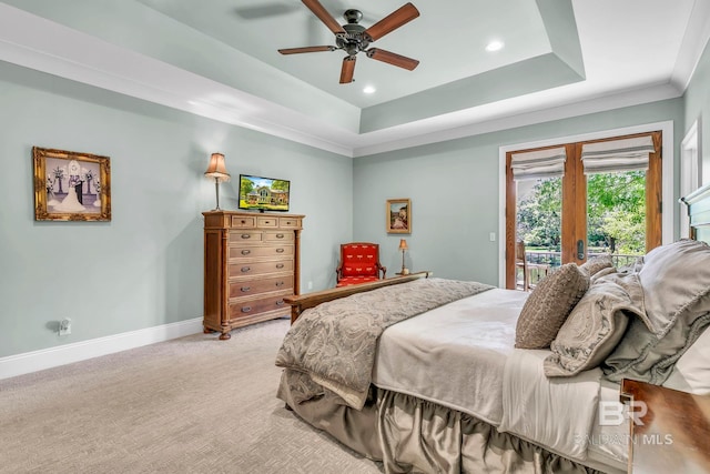 bedroom featuring a tray ceiling, access to exterior, baseboards, recessed lighting, and light colored carpet